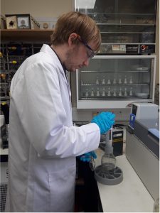 Harvey preparing carbonate samples to be reacted with phosphoric acid to produce CO2 for isotope analysis