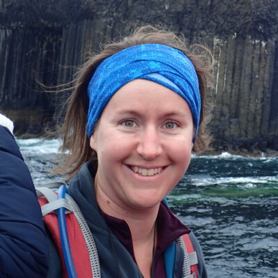 Photo of a woman smiling wearing a headband